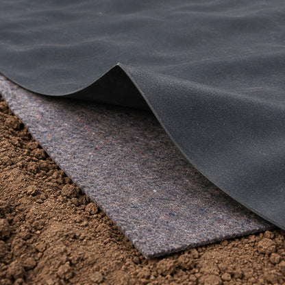Black 1.0mm EPDM pond liner lifted at the edge to show the grey 200gsm underlay beneath on prepared soil