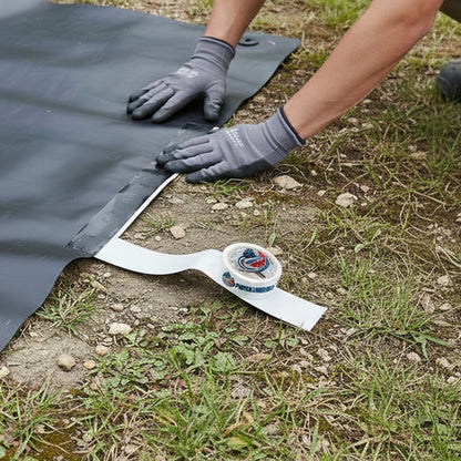 Butyl joining tape being used to connect pond liner sections