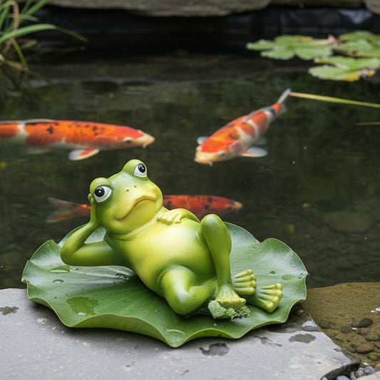 Set of 3 funny green frog garden ornaments placed around UK koi pond edge