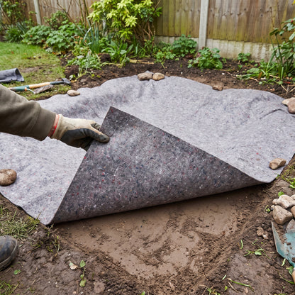 60gsm pond liner underlay laid in a garden pond excavation with one corner turned back